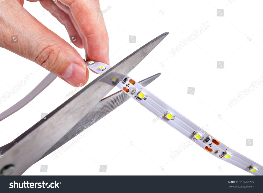cut led strip light closeup-of-hands-holding-a-pair-of-scissors-cut-the-led-tape-isolated-on-white-background-515608795.jpg