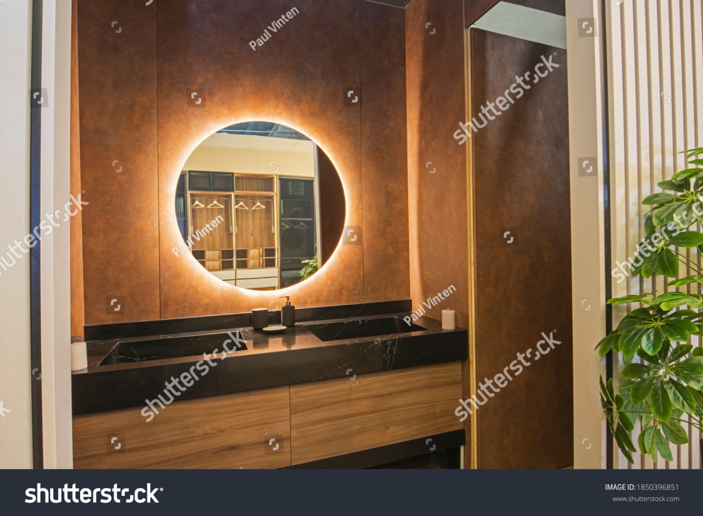 hide led strip behind mirror stock-photo-interior-design-of-a-luxury-show-home-bathroom-with-twin-sinks-and-round-mirror-1850396851.jpg