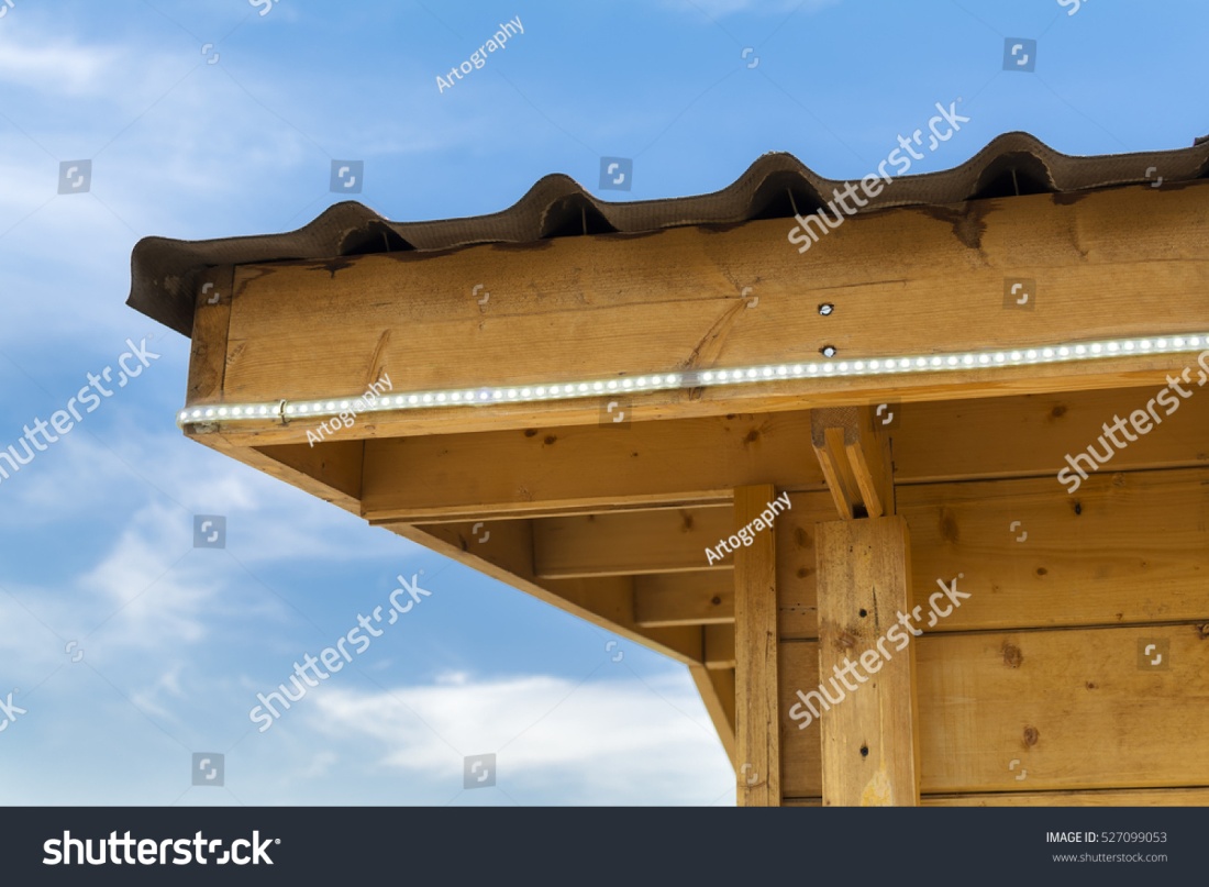 stock-photo-led-strip-light-on-wooden-kiosk-wall-527099053.jpg