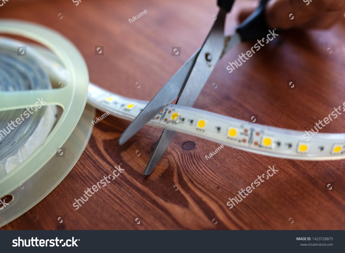 stock-photo-trimming-the-led-strip-for-installation-in-niches-at-home-close-up-1423728875.jpg