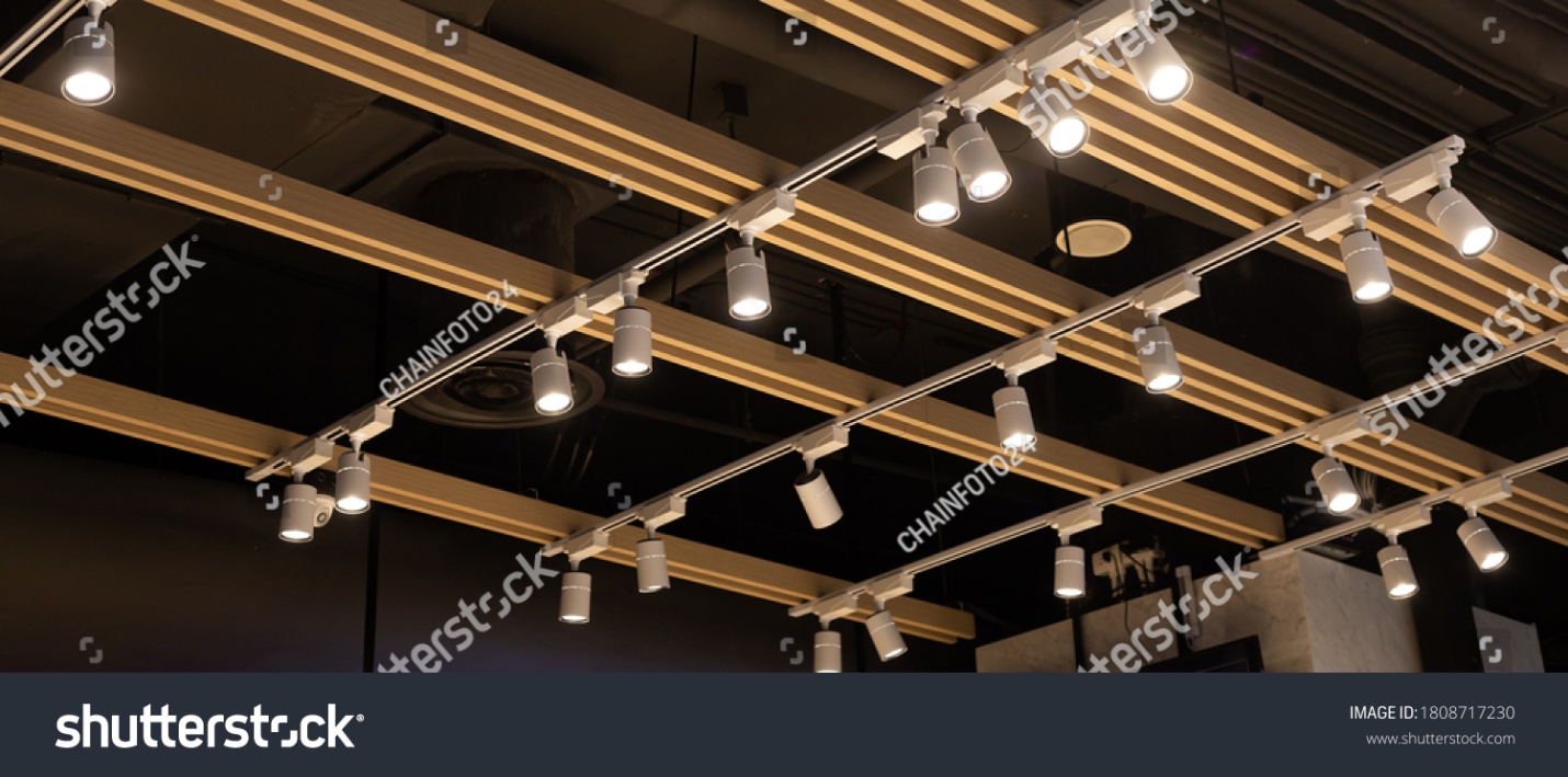 stock-photo-spotlights-set-hanging-on-the-ceiling-track-led-lighting-system-1808717230.jpg